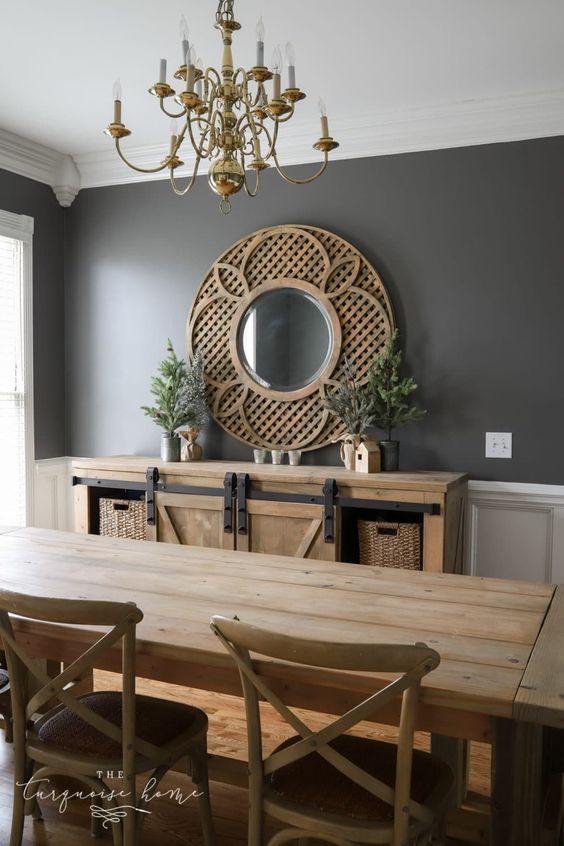 dining room with Charcoal Painted Walls and wood round mirror